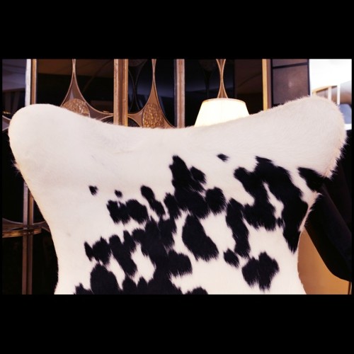 Armchair upholstered with treated natural cowhide on swivel polished stainless steel feet PC-Cowhide Egg