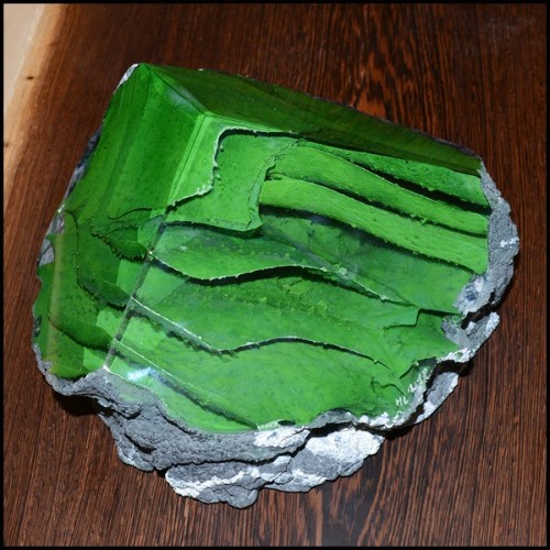 Sculpture made with glass paste colored with pigments in green powder and casted on a raw stone base PC-Glass Alchemy Green