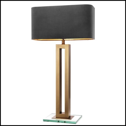 Table lamp with structure in antique brass finish and clear glass base 24-Gap