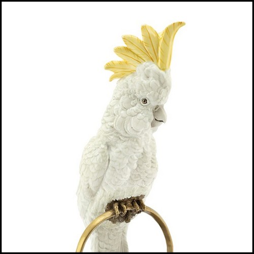 Sculpture in hand painted white porcelain with brass details 162-Parrot on Ring.
