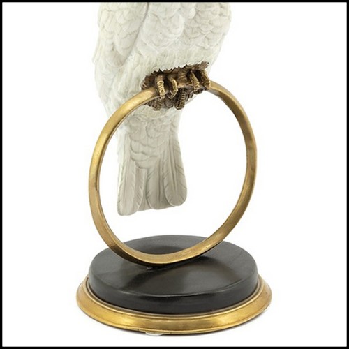 Sculpture in hand painted white porcelain with brass details 162-Parrot on Ring.