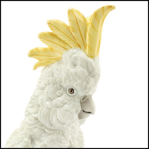 Sculpture in hand painted white porcelain with brass details 162-Parrot on Ring.