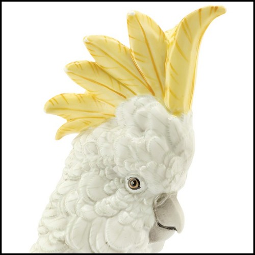 Sculpture in hand painted white porcelain with brass details 162-Parrot on Ring.