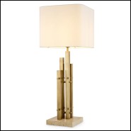 Lampe Destino W. 35 x H. 90 cm marque Eichholtz Finition laiton vintage, base travertin,