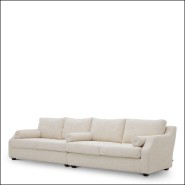 120823 - Cream upholstered sofa with sleek wooden base - Pacific Compagnie.