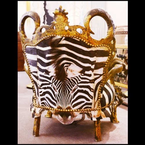 Fauteuil 120 - Zebra - Armchair featuring Burchell zebra skin and real horn accents, savage chic decor - Pacific Compagnie.