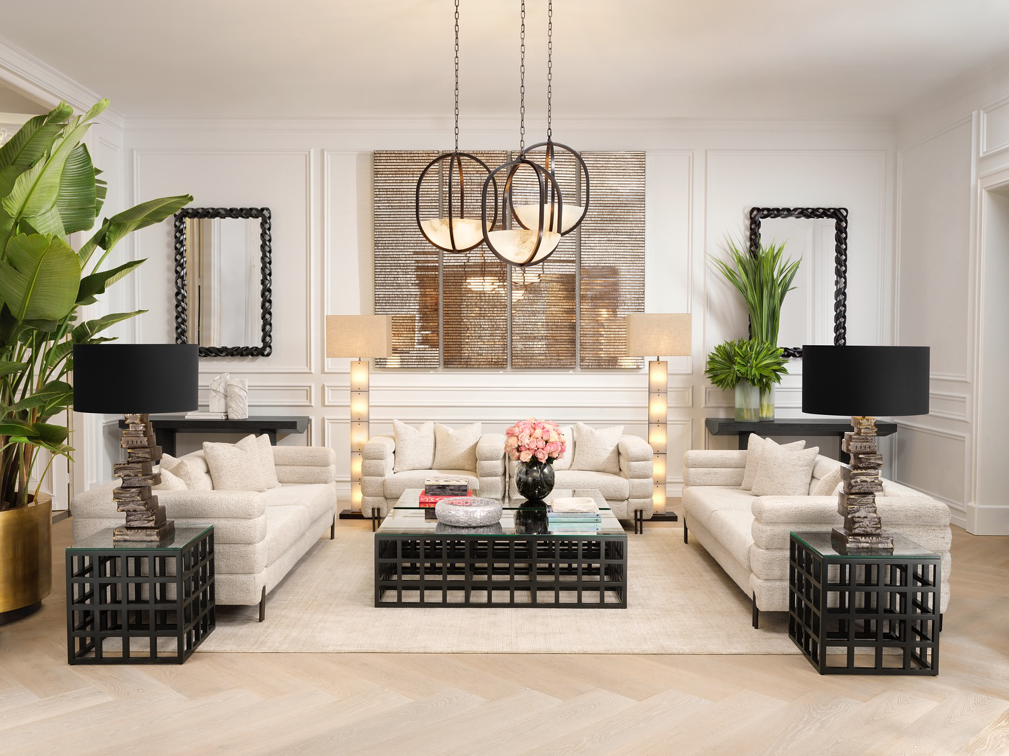 Luxurious Eichholtz living room collection with animal print sofas, gold console tables, green lamps, and decorative accents - Pacific Compagnie